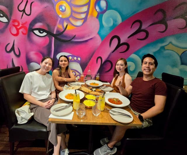 Photo of friends dining as a custom photo magnet.